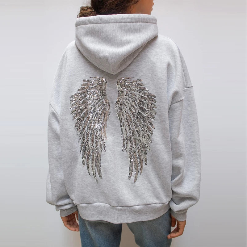 Women's grey hoodie with sequin wing detail on the back