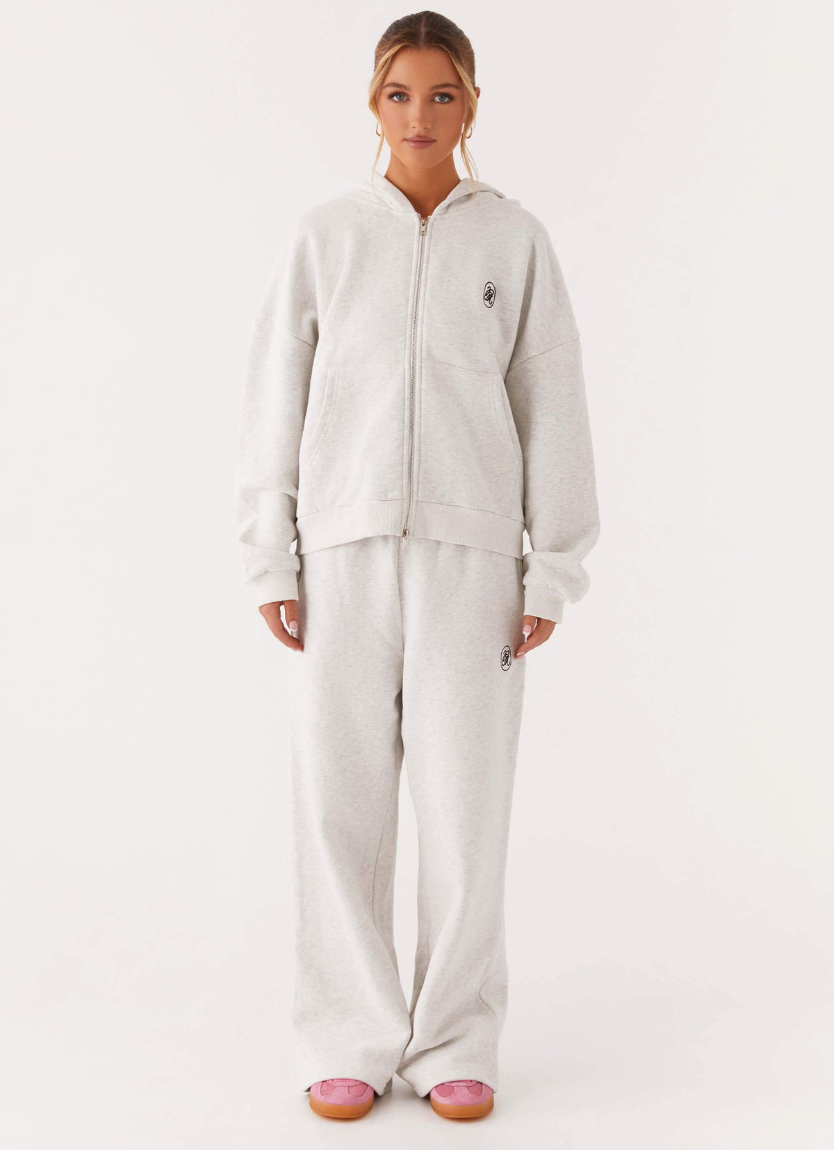 Women's grey oversized zip-up hoodie with hood and front pockets