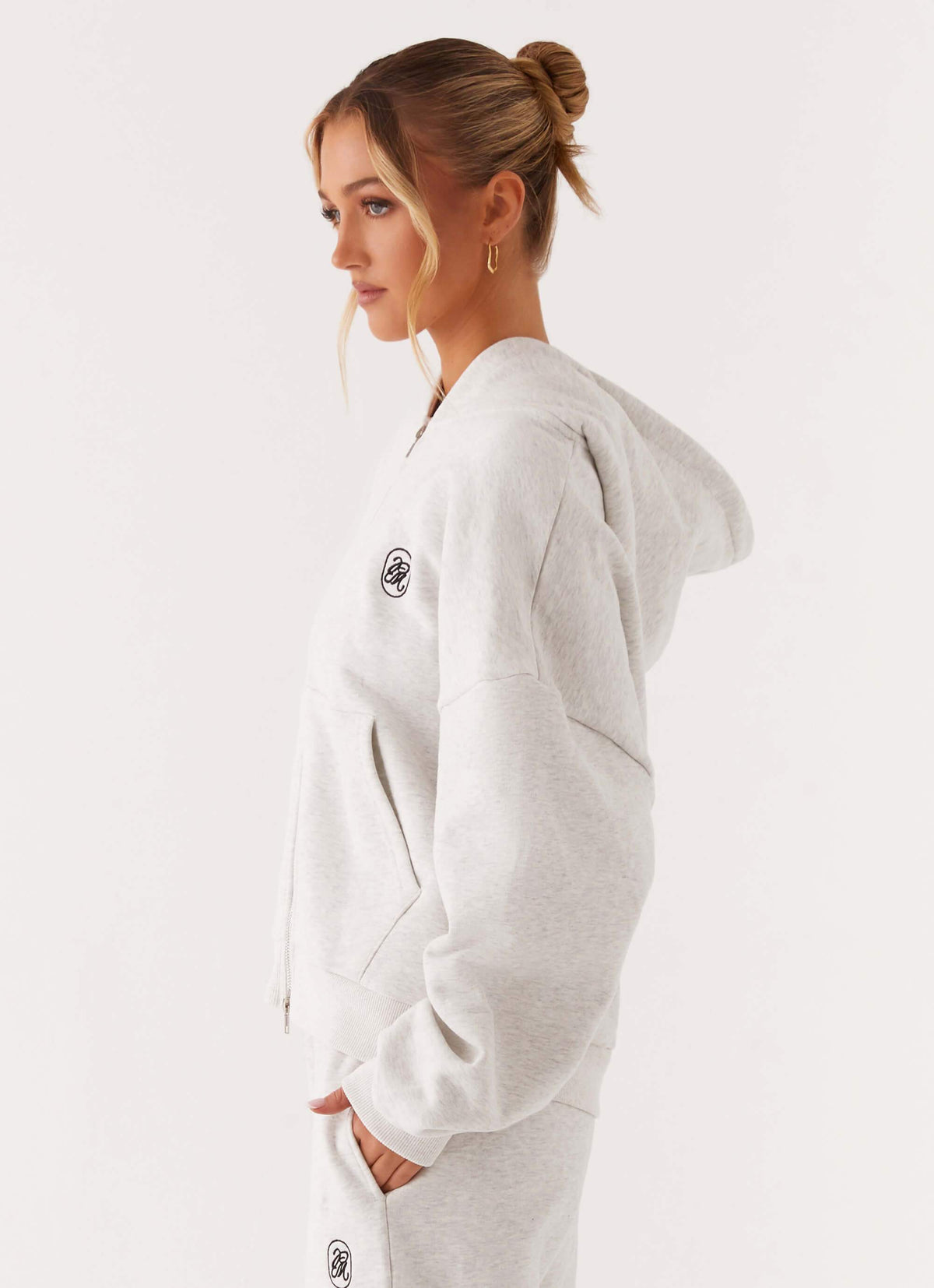 Women's grey oversized zip-up hoodie with hood and front pockets