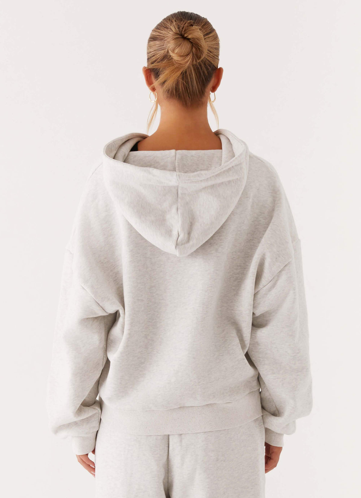 Women's grey oversized zip-up hoodie with hood and front pockets