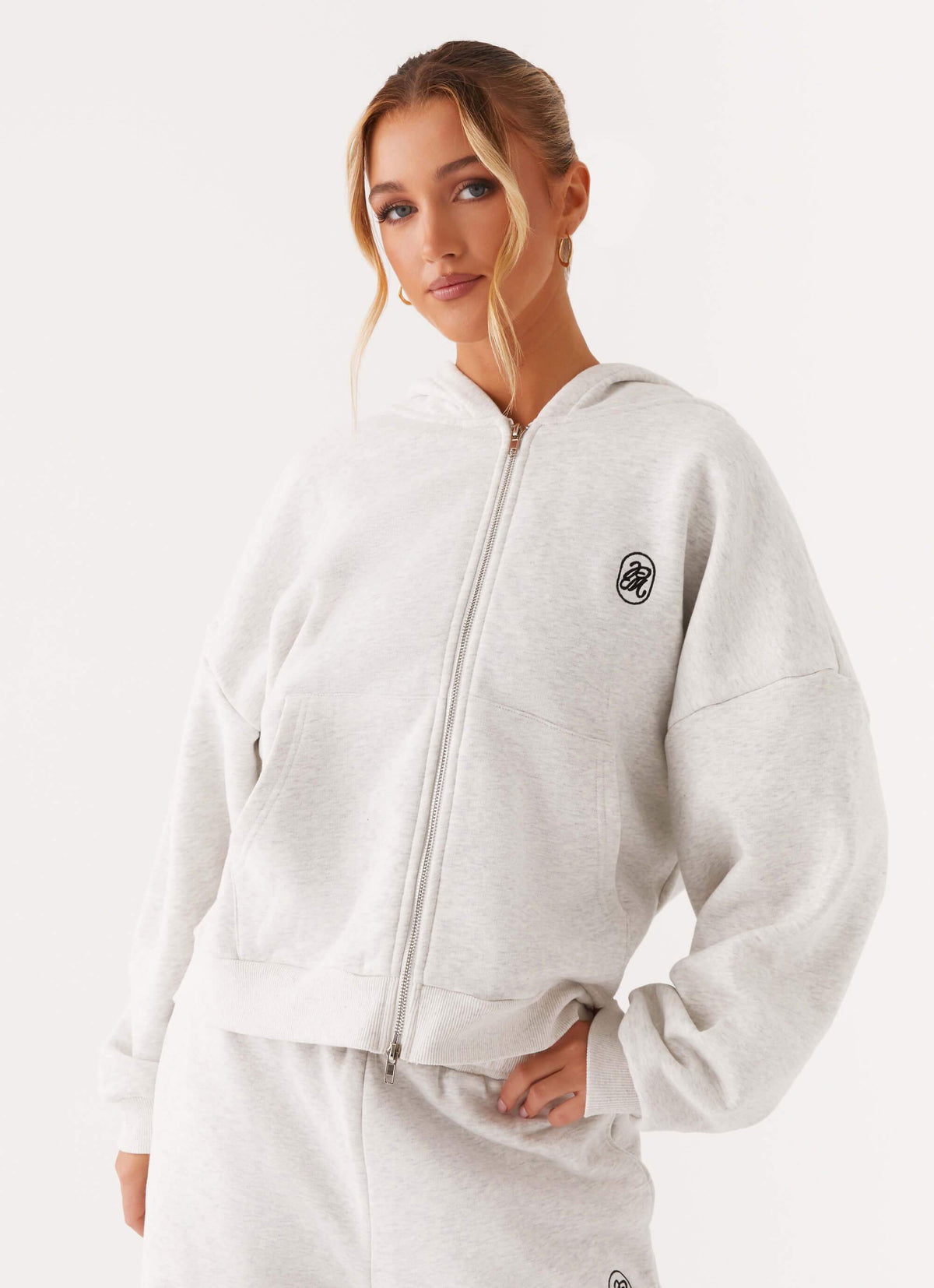 Women's grey oversized zip-up hoodie with hood and front pockets