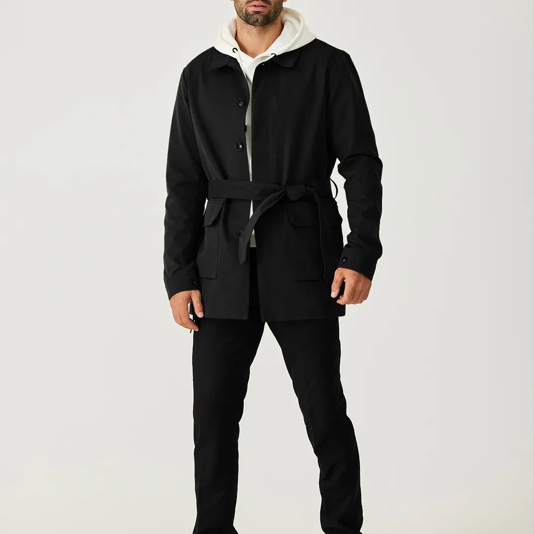 Black men's short trench coat with button front, long sleeves and rear storm flap