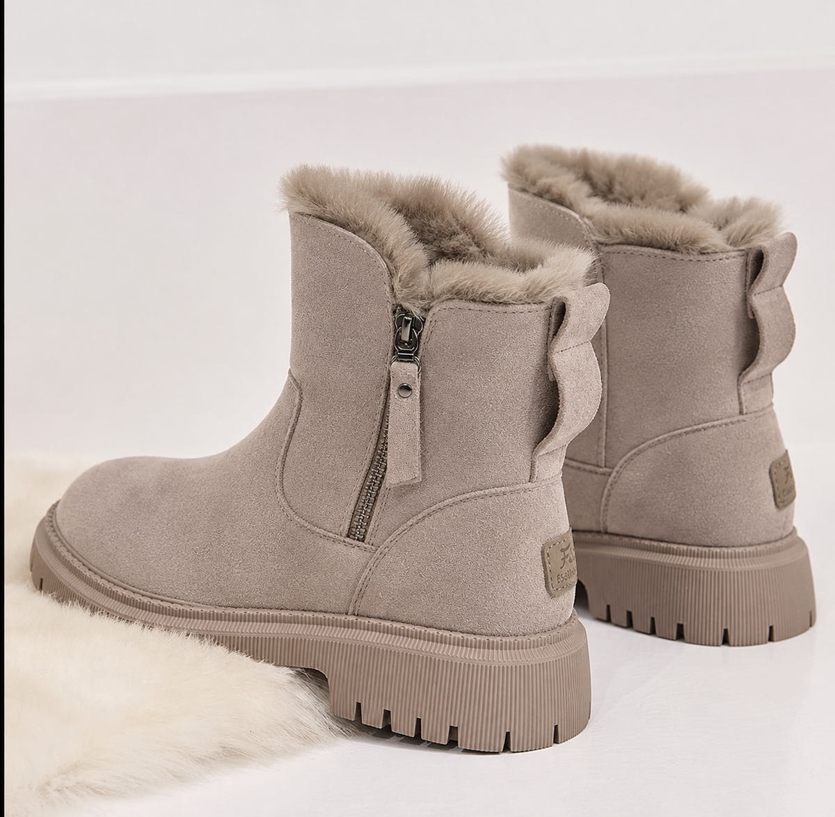 Women's fur-lined ankle boots with side zips and chunky lug soles