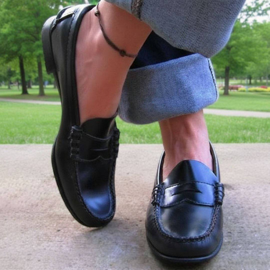 Women's penny loafers with moc-toe stitching and low heels