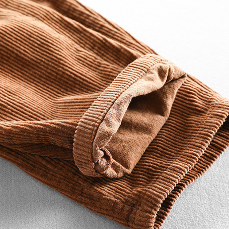 Men's tapered corduroy trousers with elasticated waist and turned-up cuffs