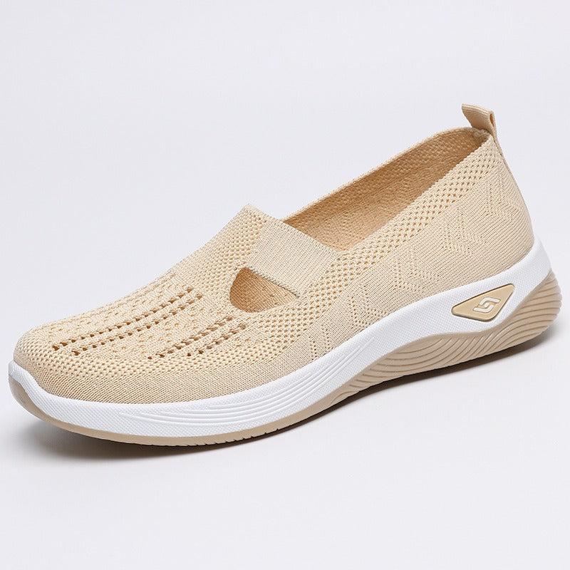 Women's slip-on knit-style trainers with a rounded toe and raised white sole