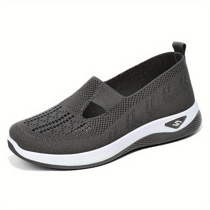 Women's slip-on knit-style trainers with a rounded toe and raised white sole