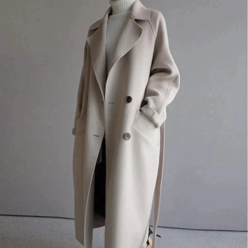 Women's long plain tailored coat with lapel collar and button front