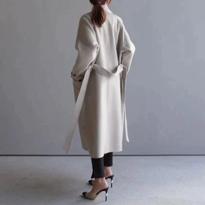 Women's long plain tailored coat with lapel collar and button front
