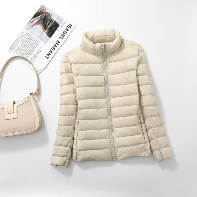Women's quilted puffer jacket with high collar and zip front