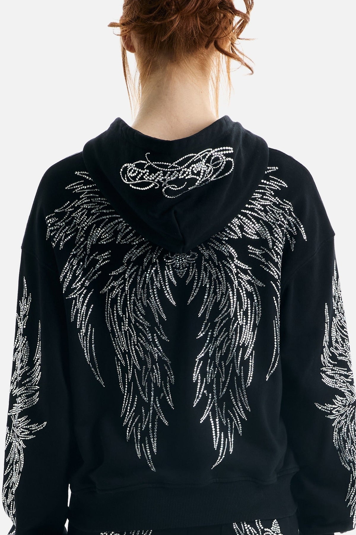 Black hoodie with silver rhinestone wing motifs, hood and zip front