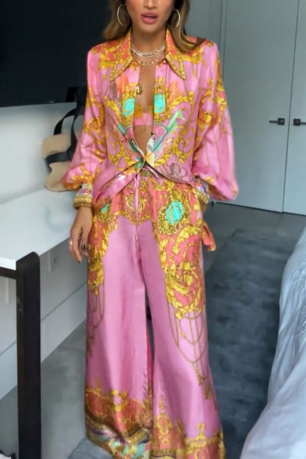 Woman wearing a pink abstract print shirt and wide-leg trousers set