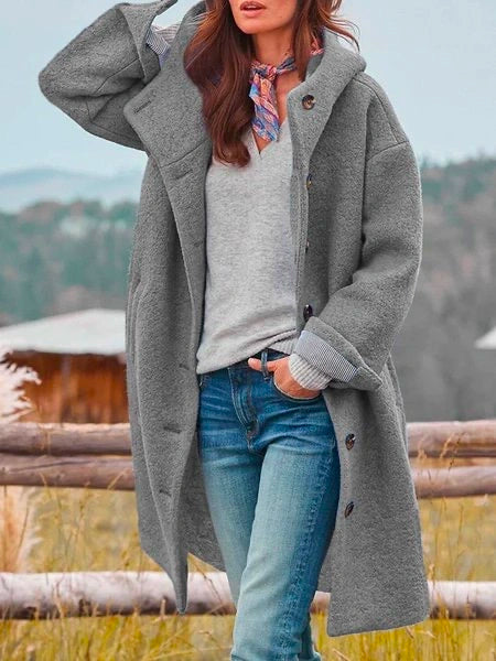 Women's hooded longline coat with button front, long sleeves and large pockets