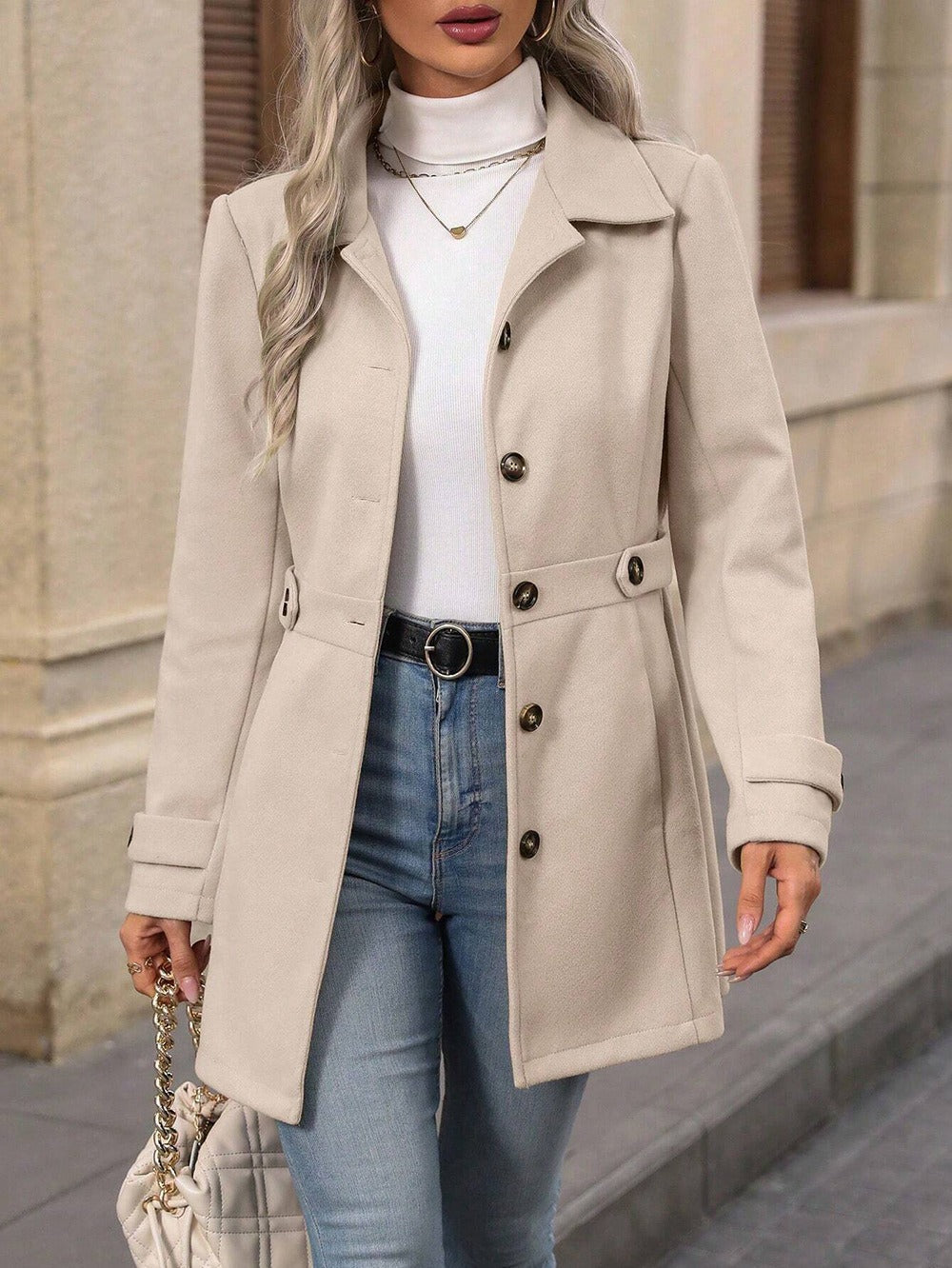 Women's belted trench coat with lapel collar and button front