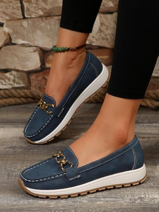 Women's flat loafers with metallic buckle trim and textured lug soles