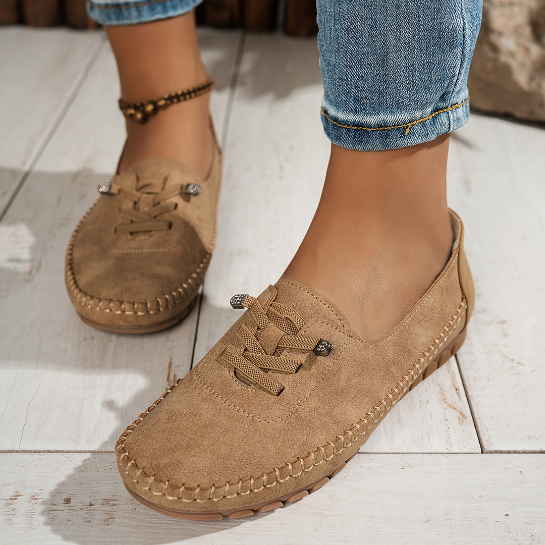 Women's moccasin loafers with lace detail, stitched trim and flat textured soles
