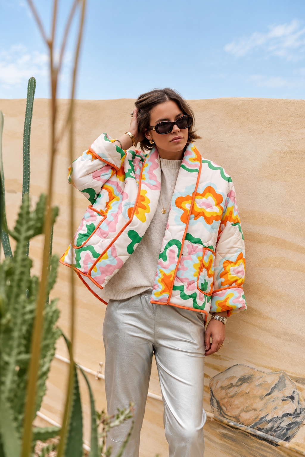 Women's multicoloured quilted floral jacket with orange edging and patch pockets
