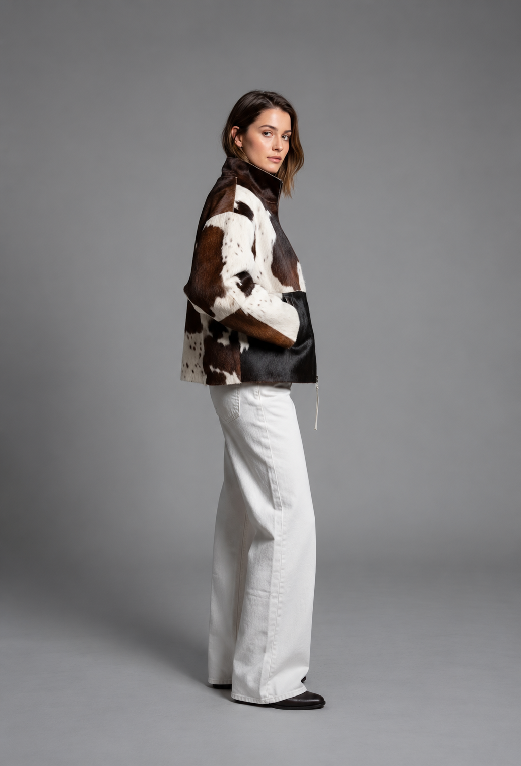Women's brown, black and cream cow print faux fur jacket with stand collar