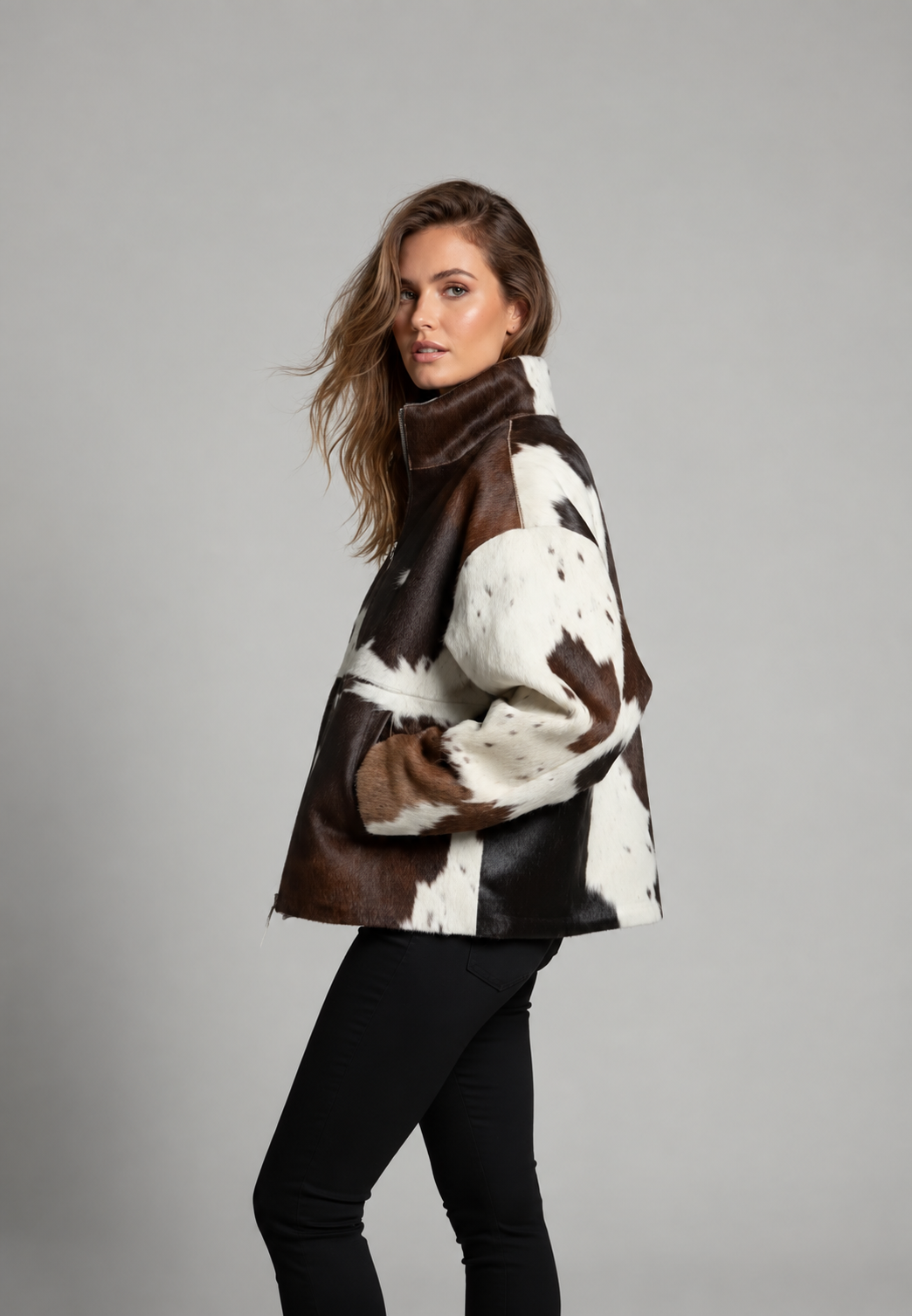 Women's brown, black and cream cow print faux fur jacket with stand collar