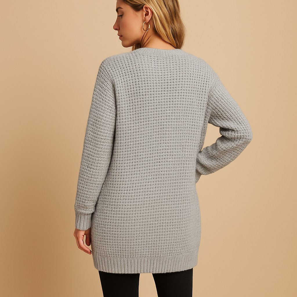 Women's long ribbed cardigan with open front, long sleeves and front patch pockets