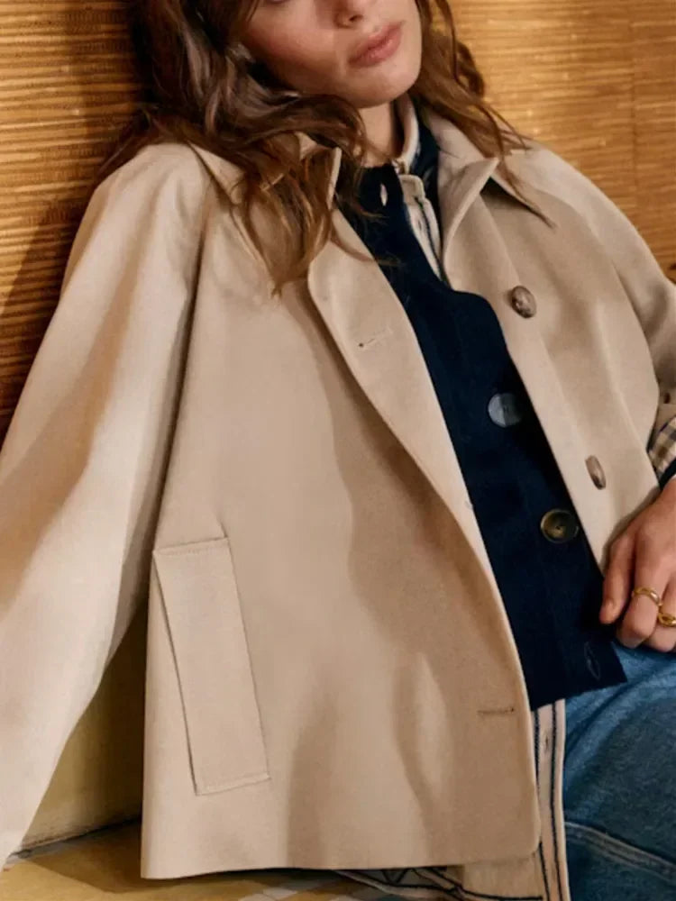 Women's beige cropped jacket with notched collar, buttons and checked cuffs