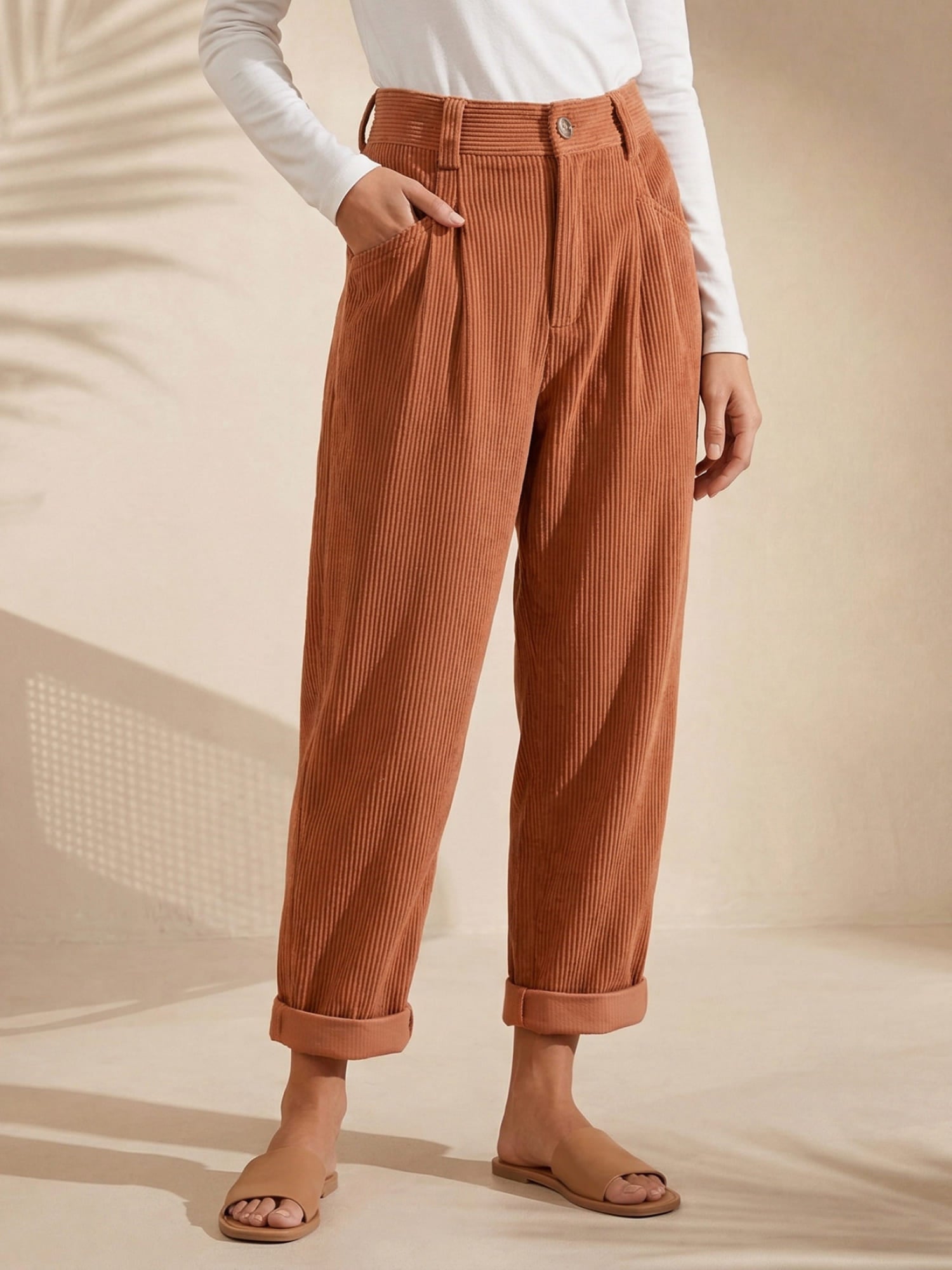 Women's high-rise corduroy trousers with straight legs, side pockets and cuffed hems