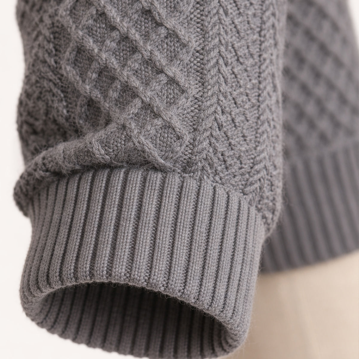 Men's textured mock neck sweater with button placket and contrasting elbow patches