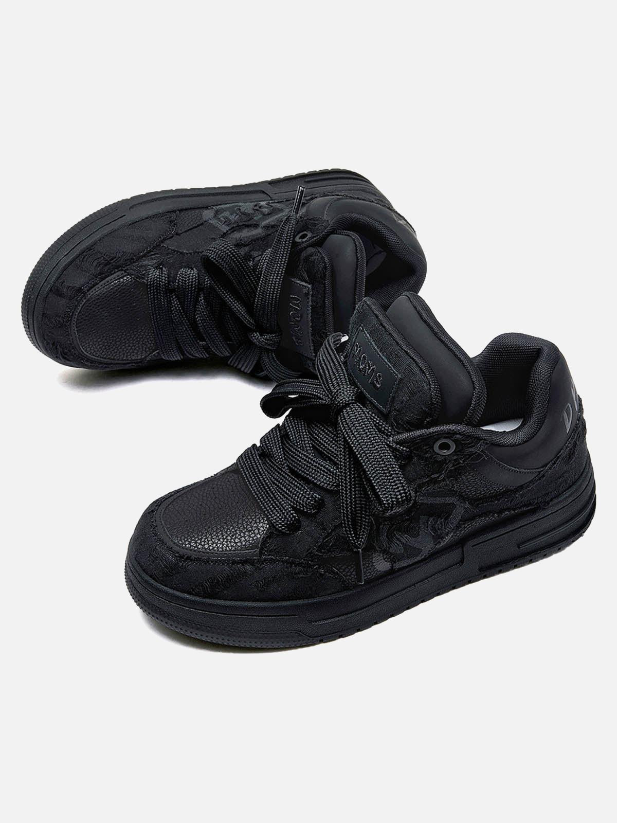 Black high-top skate trainers with lace-up fronts and camouflage side detailing