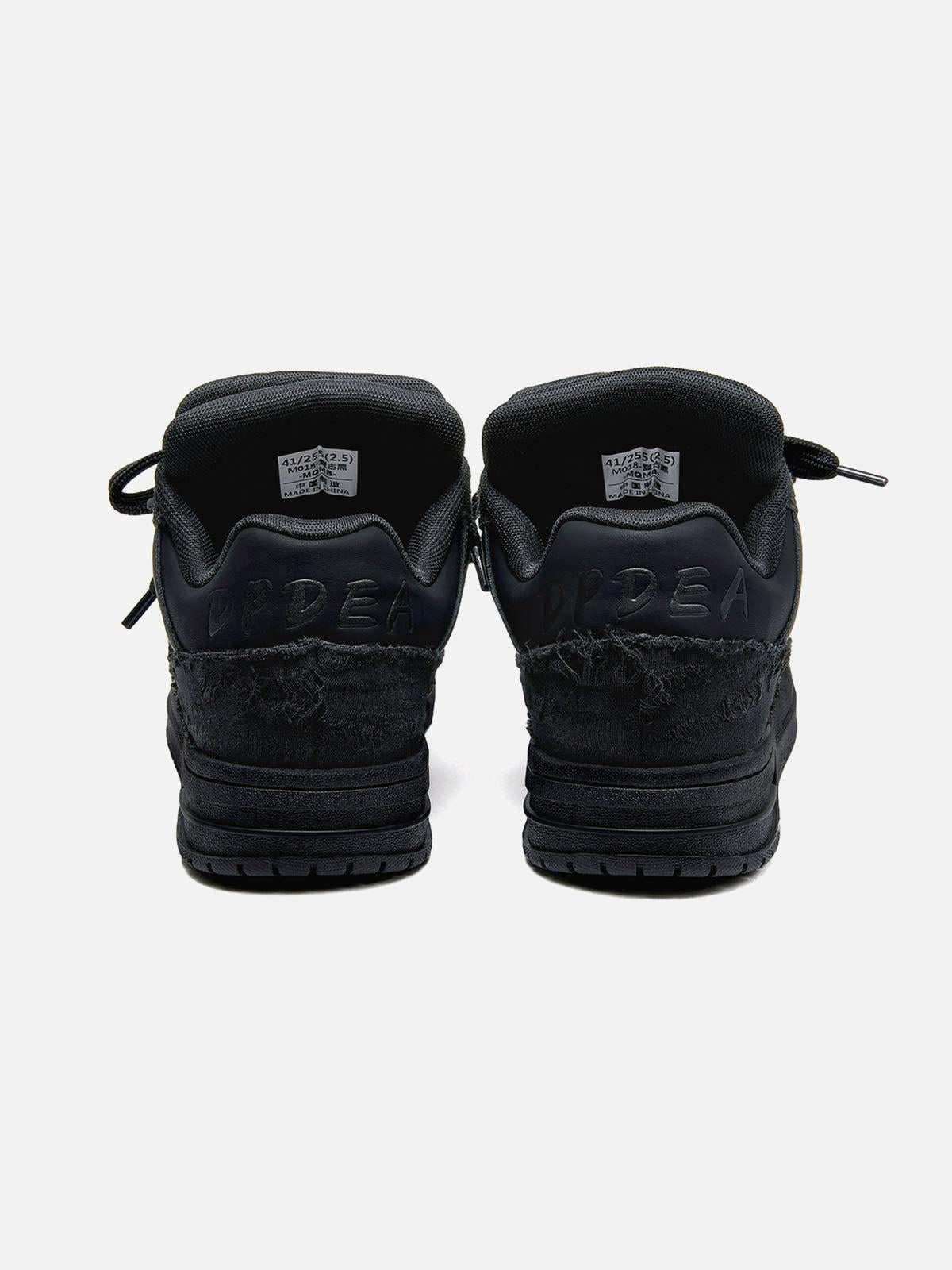 Black high-top skate trainers with lace-up fronts and camouflage side detailing
