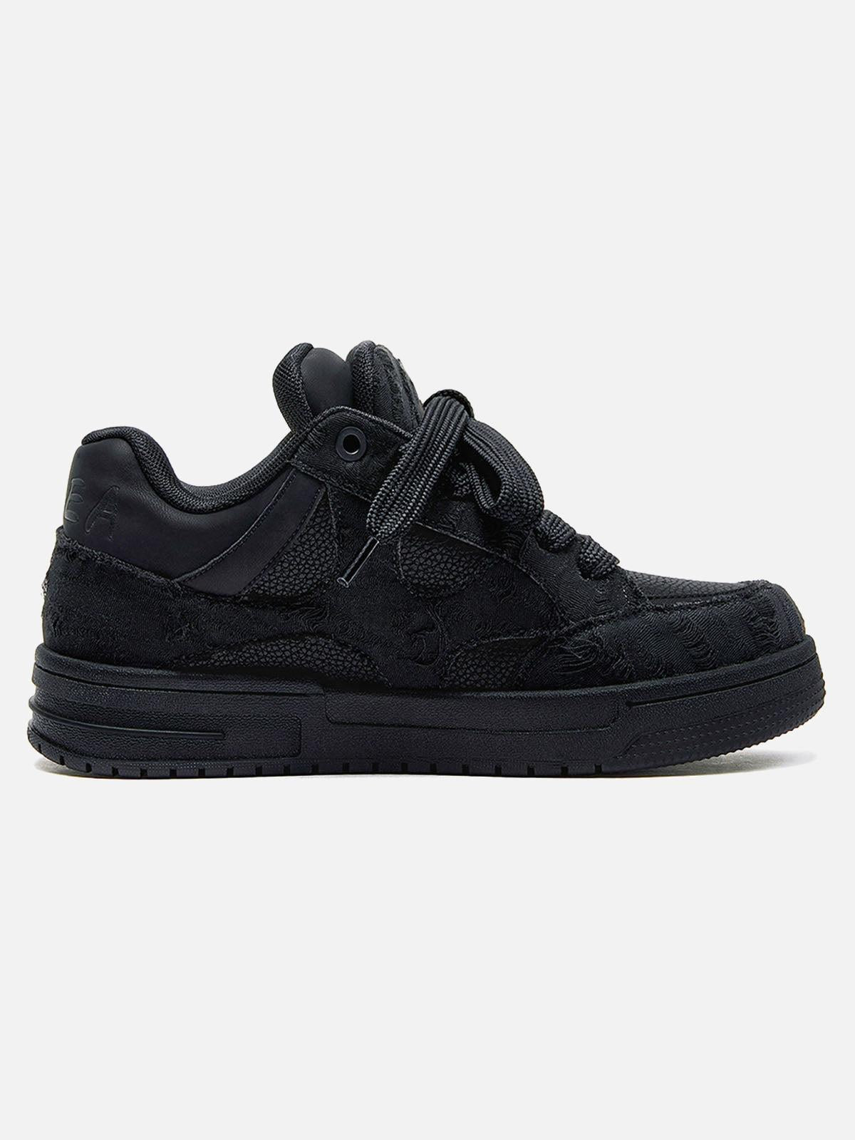 Black high-top skate trainers with lace-up fronts and camouflage side detailing