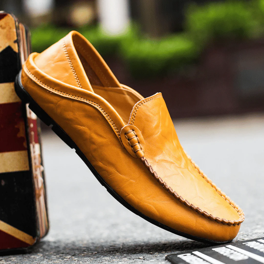 Men's slip-on loafer with stitched moc toe and decorative vamp trim