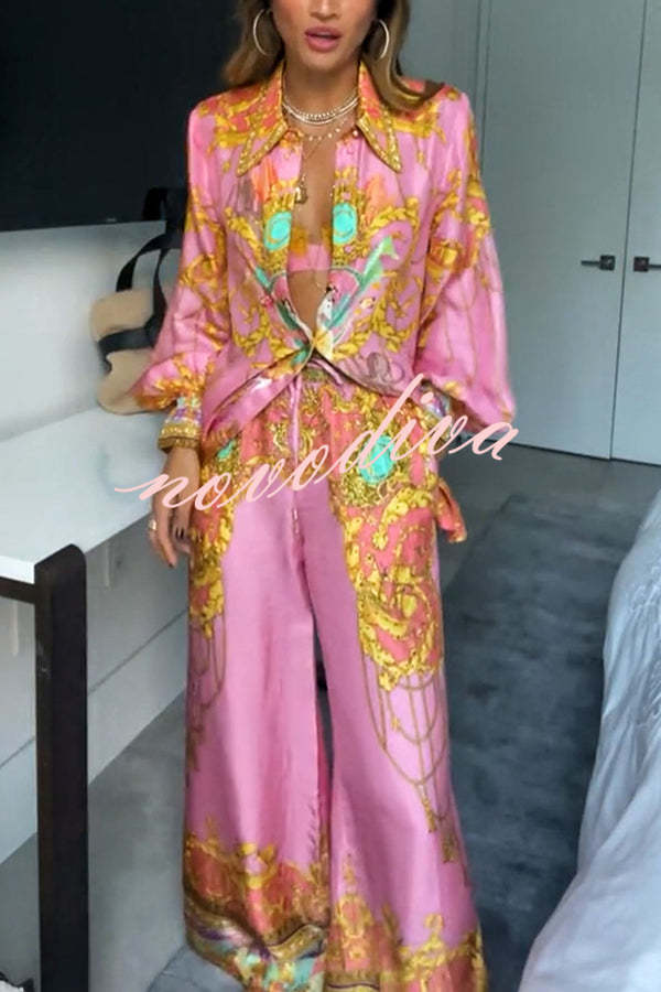 Woman wearing a pink abstract print shirt and wide-leg trousers set