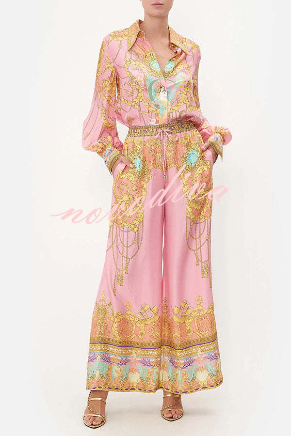 Woman wearing a pink abstract print shirt and wide-leg trousers set