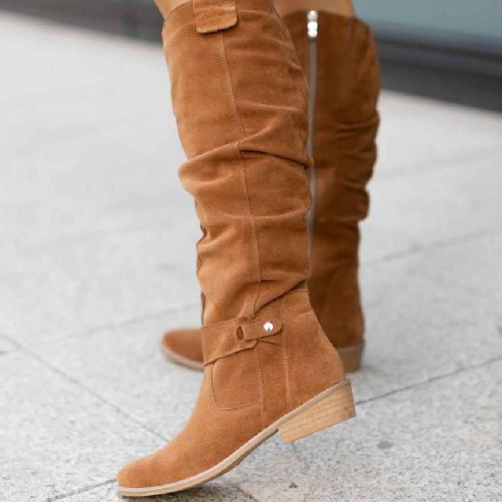 Women's slouch knee-high boots with pointed toes, flat heels and buckle details
