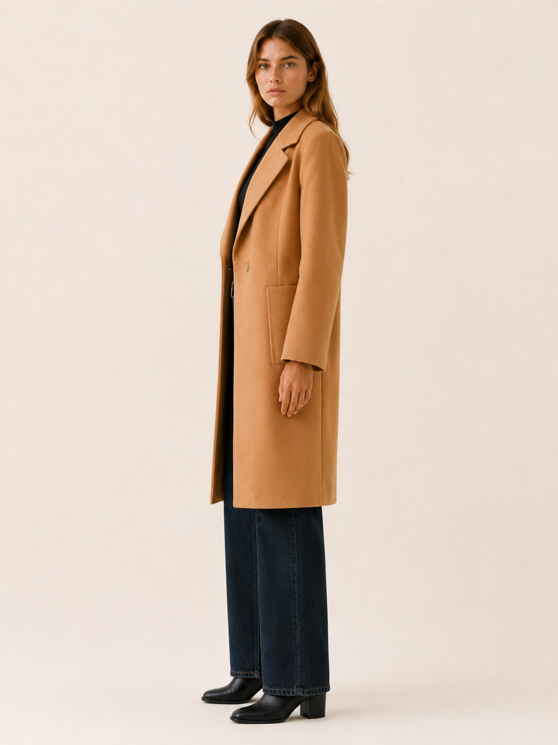 Women's long button-front coat with notched lapels and slanted pockets