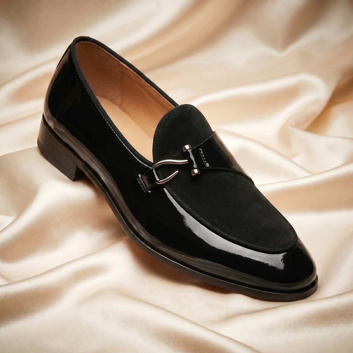 Men's slip-on loafers with almond toe, glossy finish and buckle trim