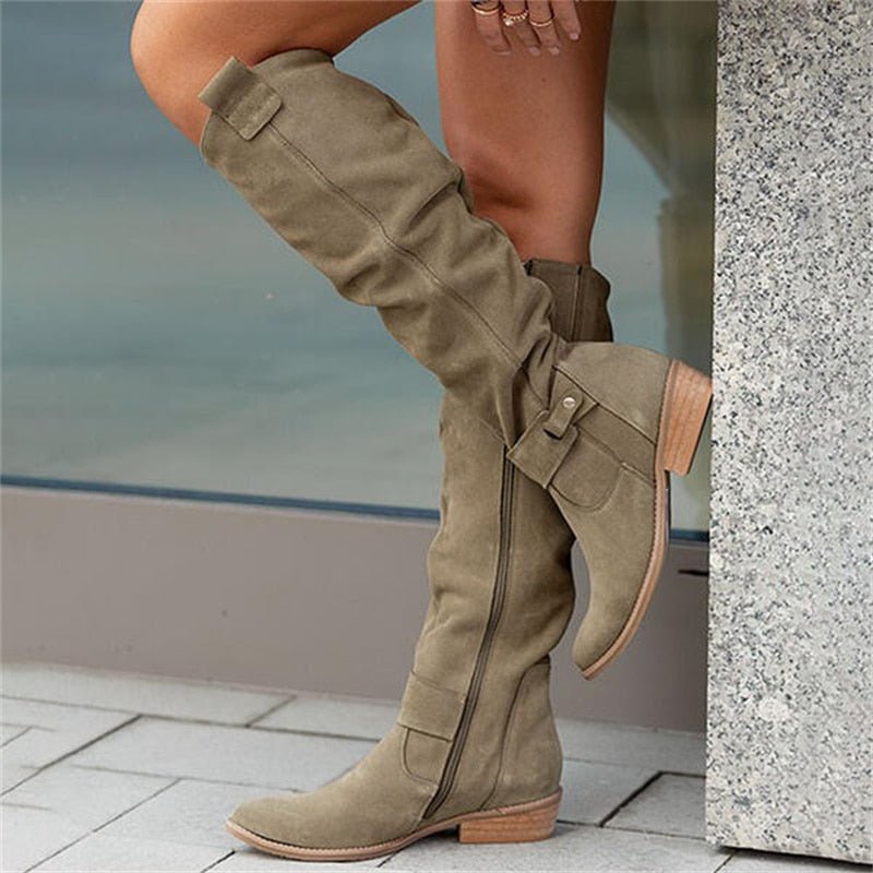 Women's slouch knee-high boots with pointed toes, flat heels and buckle details
