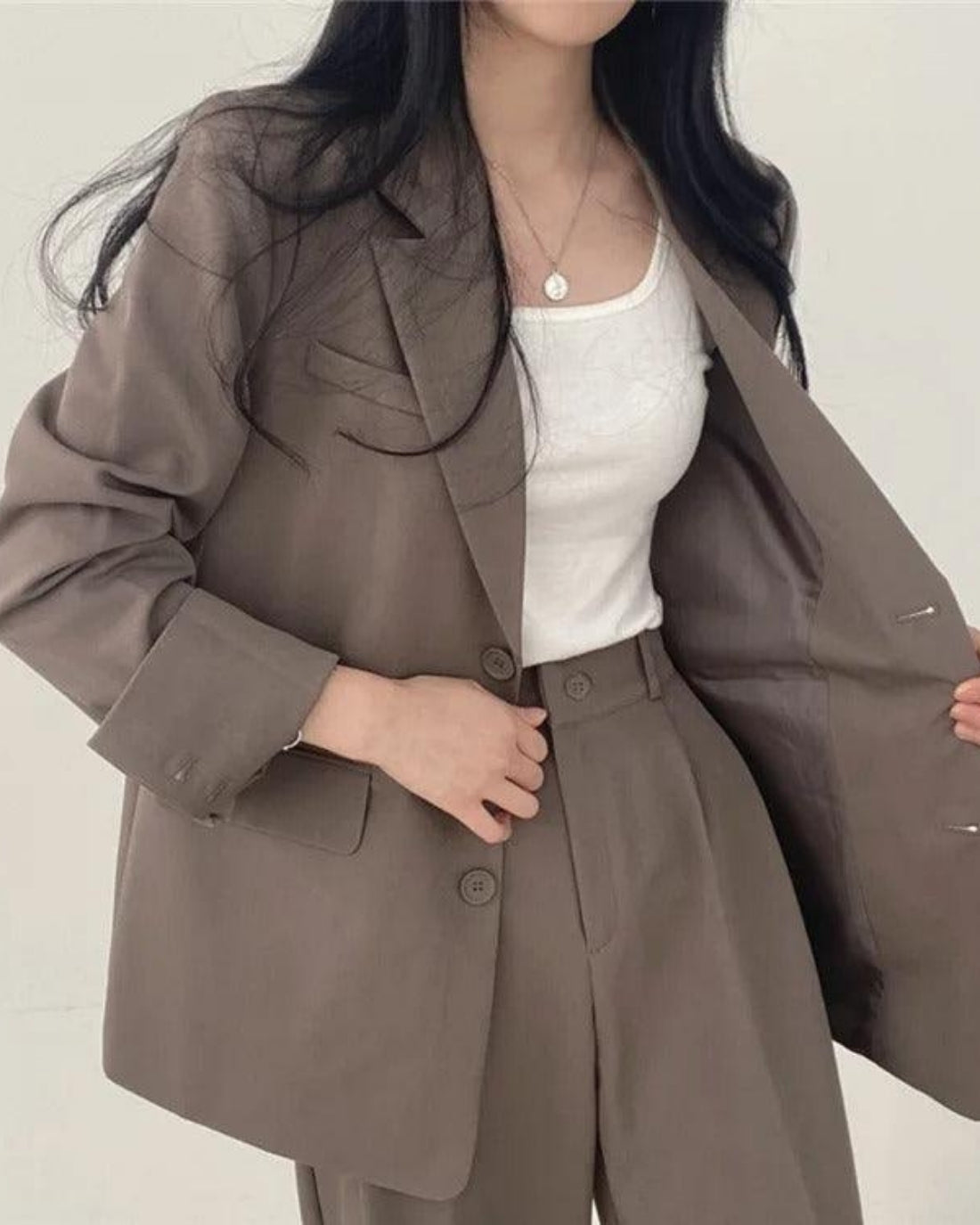 Women's oversized trouser suit set with long blazer and wide-leg trousers
