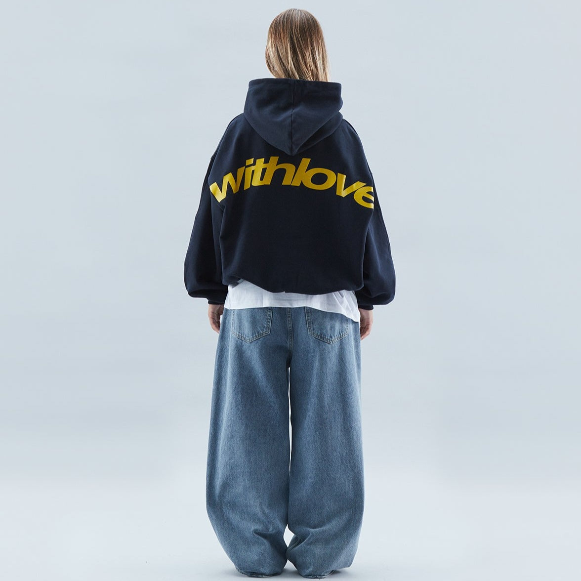 Unisex oversized hoodie with hood, long sleeves and large back text graphic