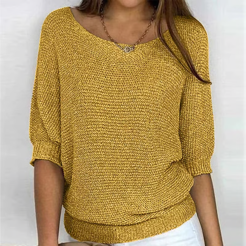 Women's relaxed plain knit sweater with round neckline and three-quarter sleeves