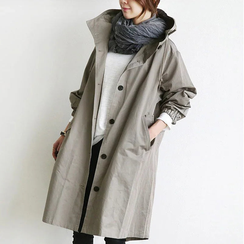 Women's long hooded trench coat with button front and side pockets