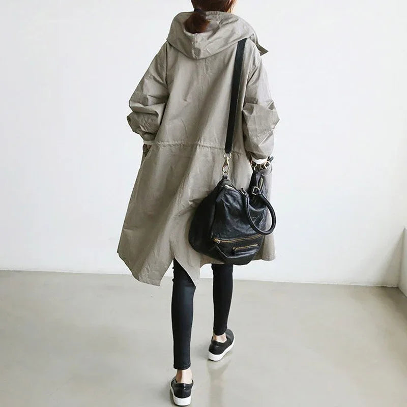 Women's long hooded trench coat with button front and side pockets