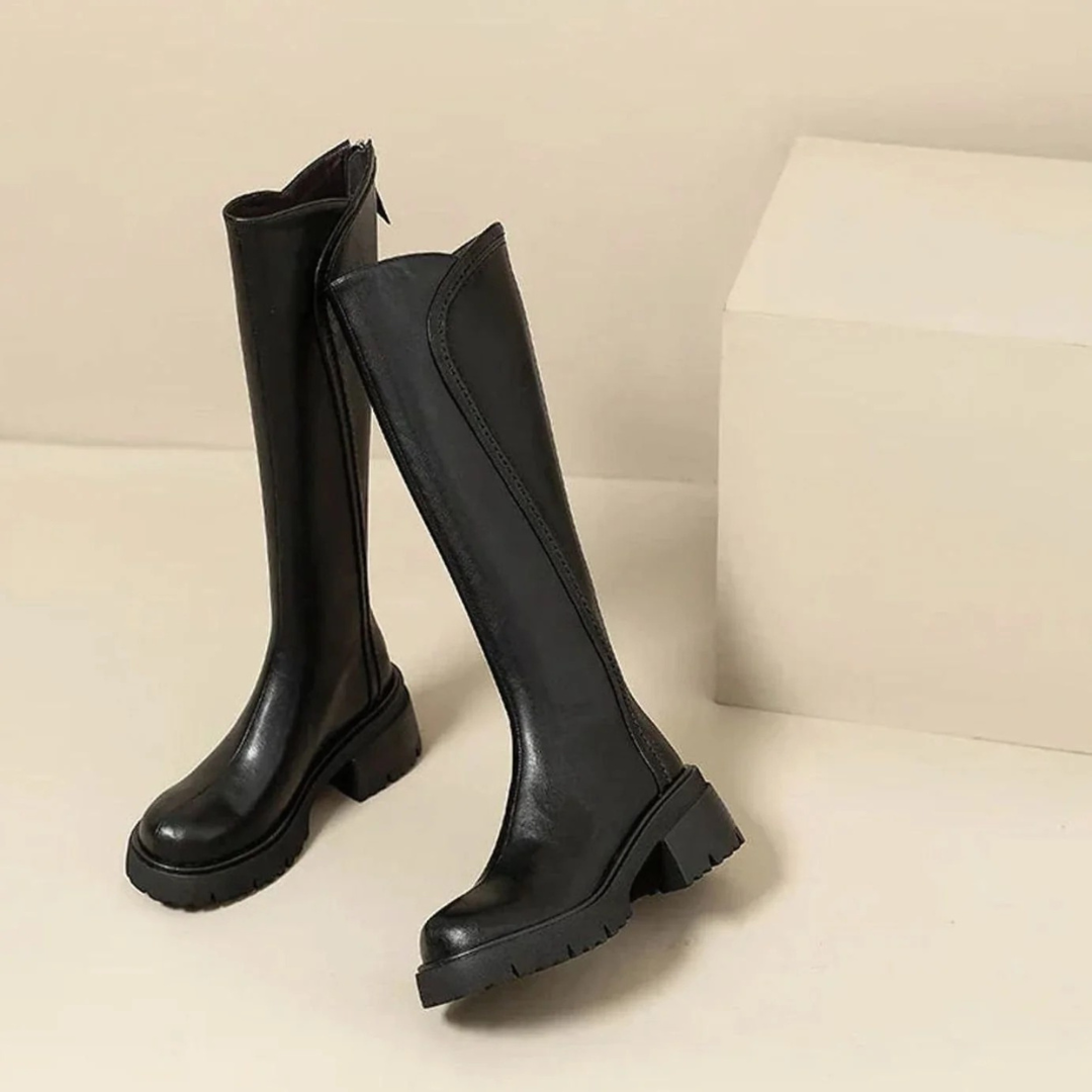 Women's tall boots with round toes, side zips, low block heels and lugged soles