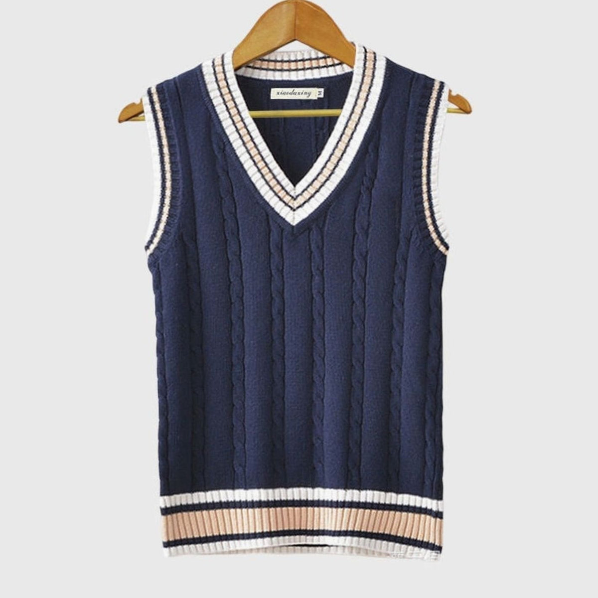 Women's sleeveless cable-knit sweater vest with striped V-neck and hem