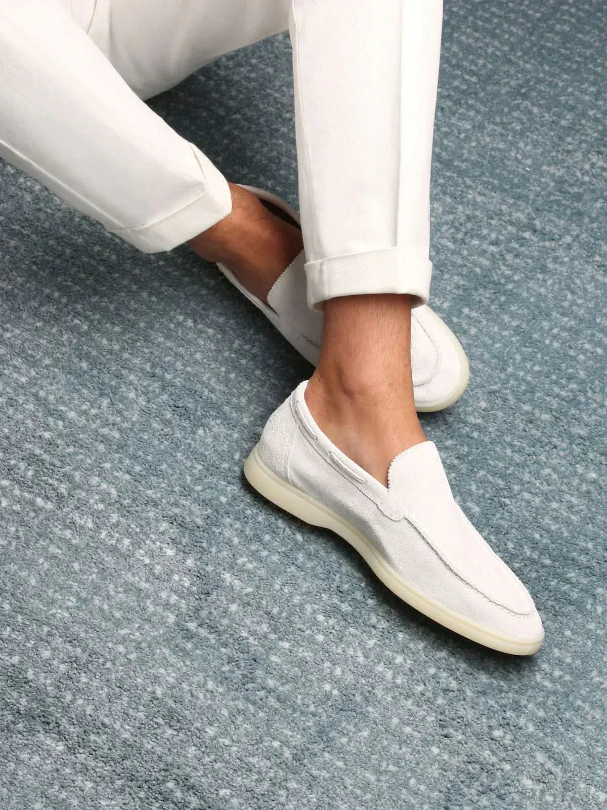 Men's white classic slip-on loafers with rounded toes and flat soles