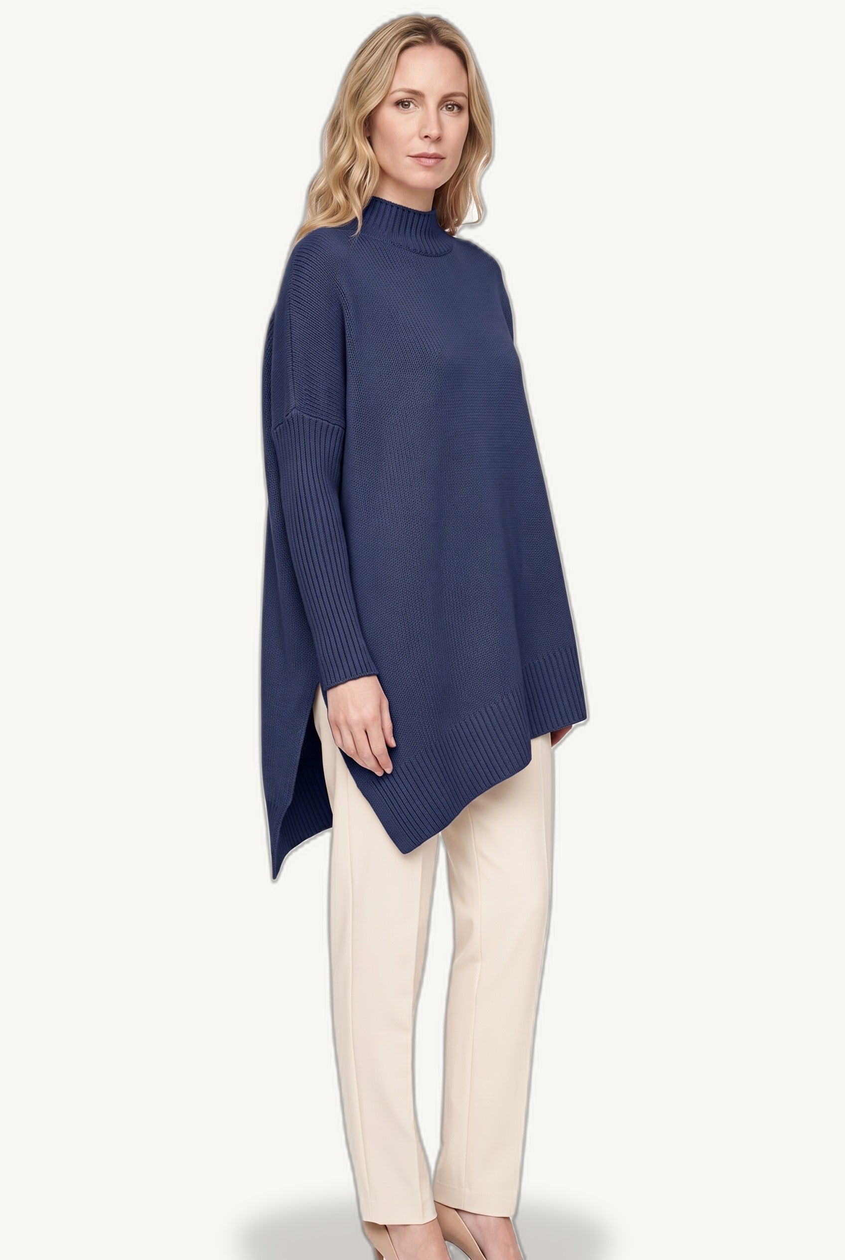 Women's oversized turtleneck sweater with long sleeves and asymmetric hem