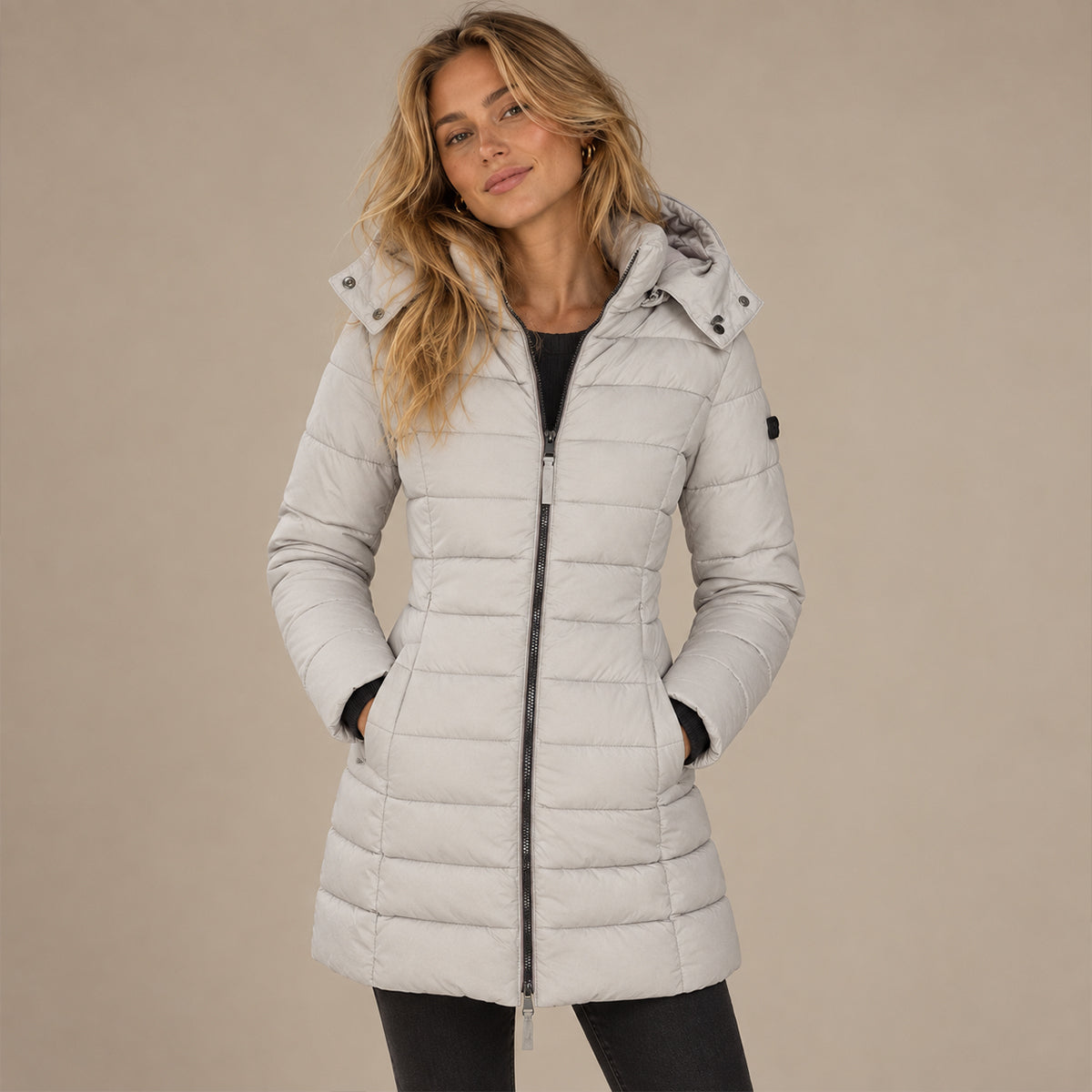 Women's hooded quilted puffer jacket with long sleeves and full zip