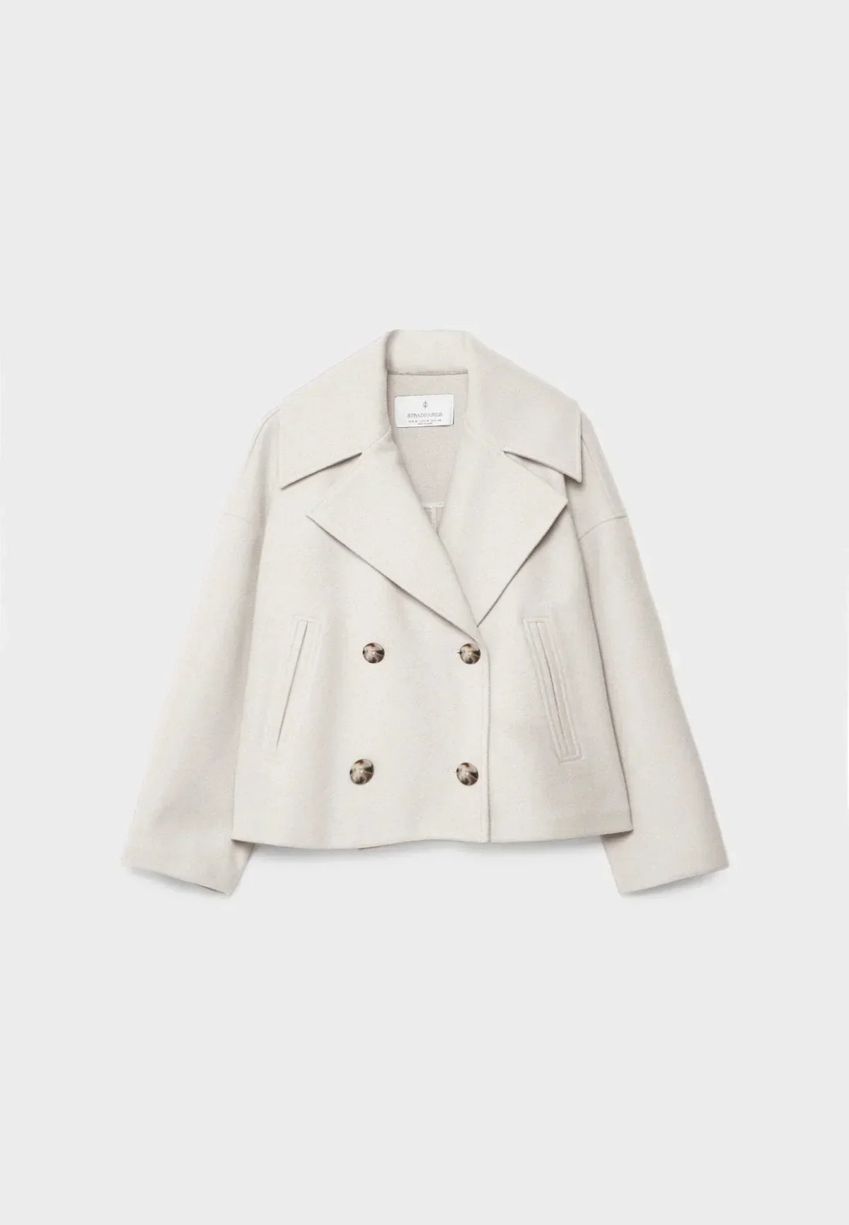 Women's cropped double-breasted jacket with wide lapels and welt pockets