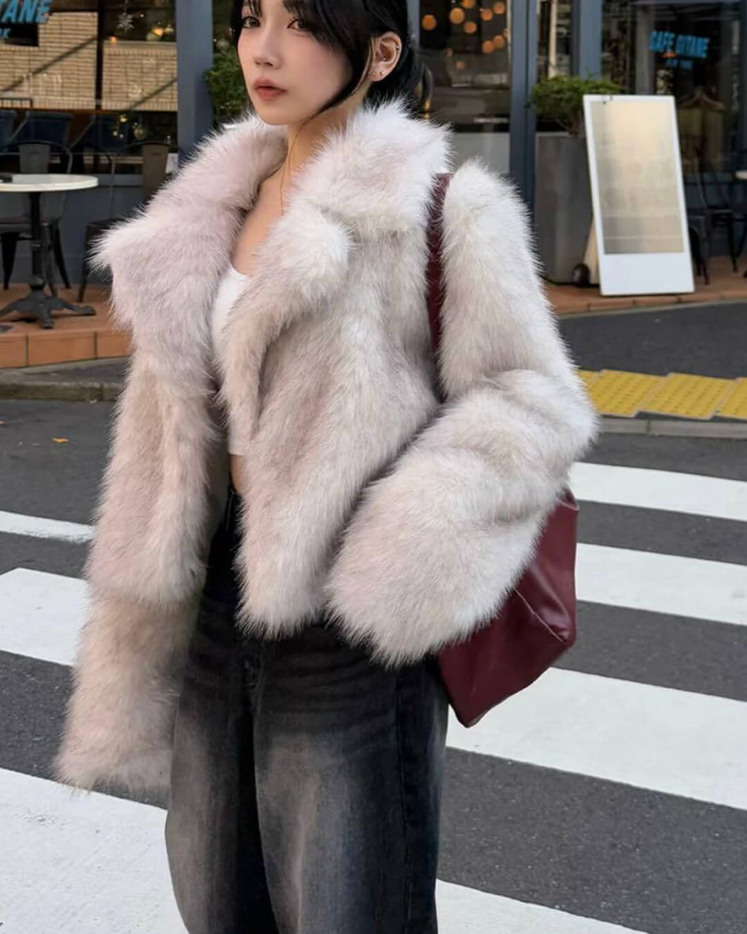Women's cream cropped jacket with a textured finish and long sleeves