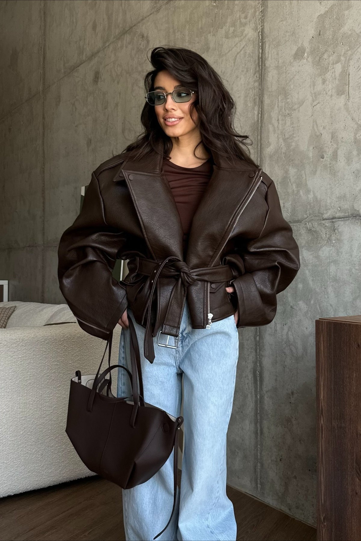 Women's dark brown biker jacket with asymmetric zip, lapels and waist belt